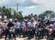 Berangkat Kampanye, Radhan-Rasyid Kendarai Sepeda Motor Diiringi Simpatisan dan Pendukung