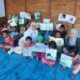 Dinas Perpustakaan Konsel Gelar Kegiatan Retelling Bersama Anak-Anak Pesisir Desa Wawatu